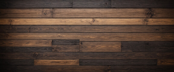 Naklejka premium detailed texture of dark wooden planks with varying shades and grains, showing a rustic and natural pattern