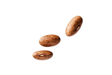 Obraz premium Three brown beans are flying through the air, isolated