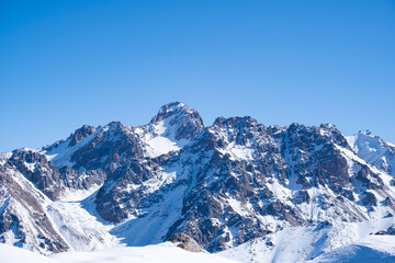 Snowy mountain peaks not far from Almaty, mountain views from kumbel peak. A popular tourist route in the mountains.
