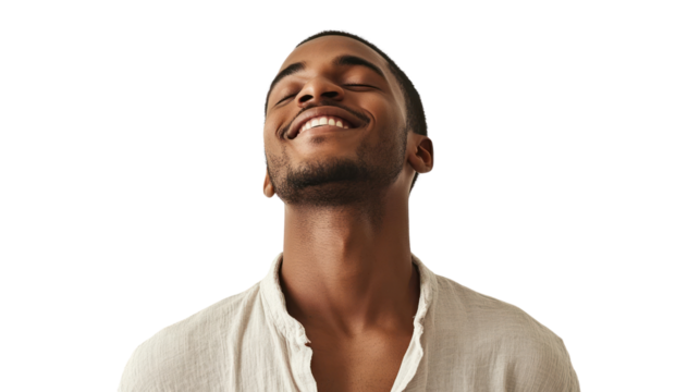 Joyful man smiling with eyes closed, conveying happiness and positivity, isolated on white background.