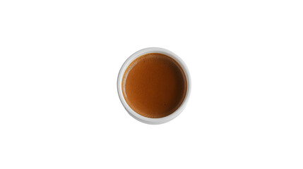 Obraz premium Top view of a small cup filled with brown liquid, isolated on a black background.