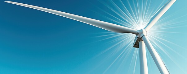 Earth Day Resources Concepts. Wind turbine against a bright blue sky generating renewable energy.