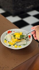 A bowl of iced cendol with jackfruit
