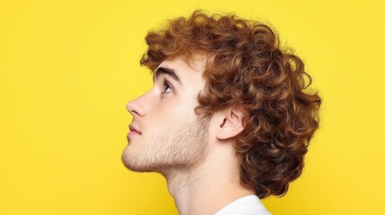 Fototapeta premium Young Man Profile Curly Hair Yellow Background Portrait Photography