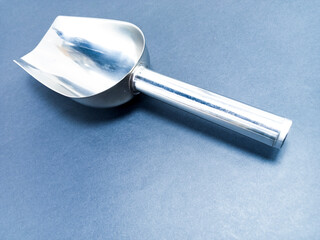 small stainless shovel, stainless coffee shovel, isolated black background with stainless steel...