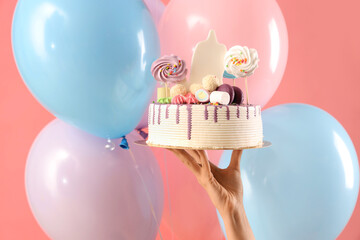 Woman with Birthday cake and balloons on pink background, closeup