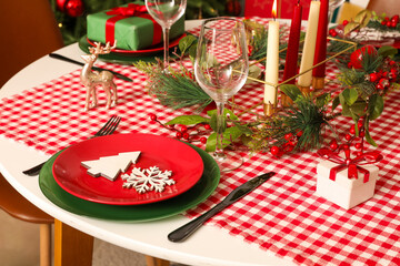 Table setting with Christmas decorations in living room