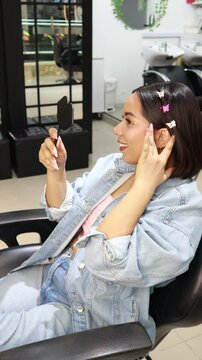 Latina girl happily wearing makeup
