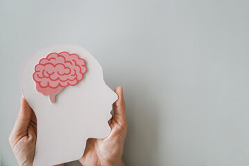 hands holding brain paper cutout, Epilepsy and Alzheimer awareness, seizure disorder, mental health...