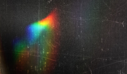 prism light leak texture for photo overlay and effect. lens flare in abstract background. bokeh effect with glow and magical lights on black background.