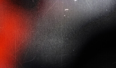 Grainy red gradient background fading to black with a subtle light source emanating from the top