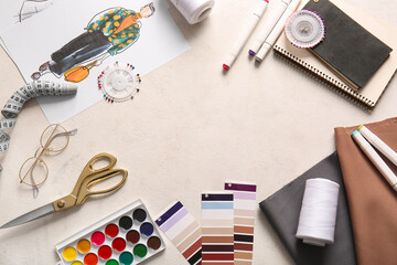 Frame made of zippers, needles set and color palette on light background