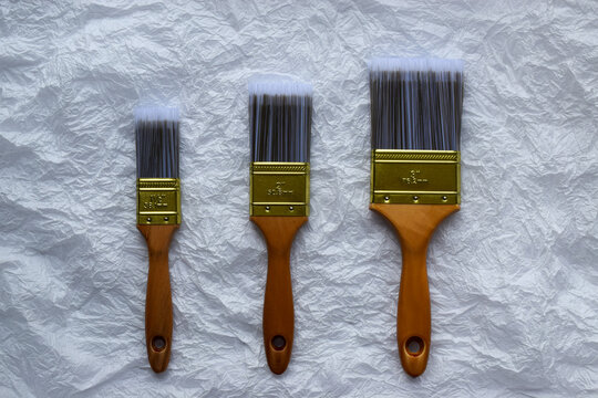Artistic brushes on minimalist white textured background