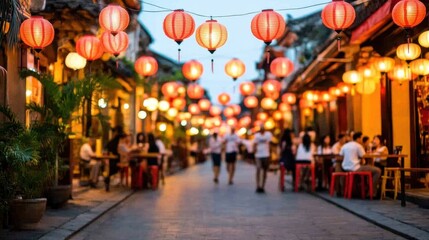A vibrant street scene illuminated by red lanterns, with people dining and walking, creating a lively atmosphere at dusk.