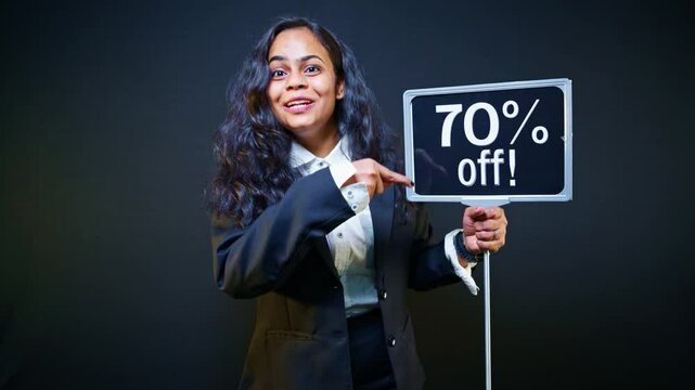 Model shows signboard reading exclusive cut near festival