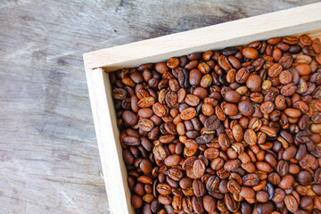 Close-Up of Roasted Coffee Beans in Wooden Box