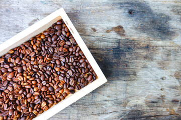Close-Up of Roasted Coffee Beans in Wooden Box