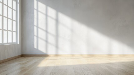 Sunlight streaming through a window into an empty room with wooden floor and white walls, creating a serene ambiance.
