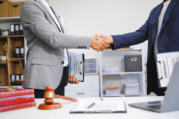 A businessman and a male lawyer or a team of judges discuss a joint investment meeting. They...