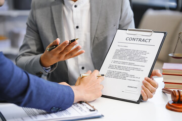 A businessman and a male lawyer or a team of judges discuss a joint investment meeting. They...