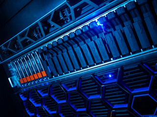 High-Tech Data Storage Rack with Illuminated Components in Blue Light