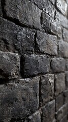 Fototapeta premium A close-up view of a textured stone wall, showcasing its rugged surface and shadows.