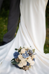 Bride and Groom with Elegant Wedding Dress and Rustic Flower Bouquet

