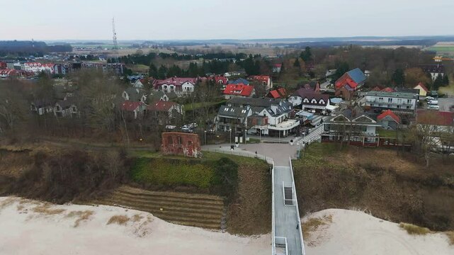 Aerial view of the pier and the ruins of the church in Trzesacz at the Baltic seaside