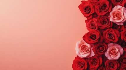 A vibrant arrangement of red and pink roses against a soft peach background, creating a romantic and elegant aesthetic.