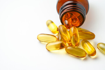 Vitamin capsules in a bottle, soft gels, Fish oil capsules, omega 3, omega 9, vitamin D, vitamin E