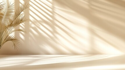Minimalist beige interior with sunlit shadows and palm leaves.