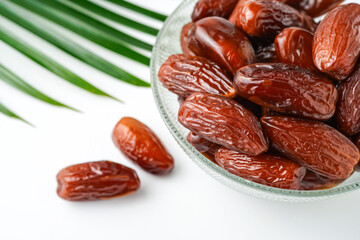 Dates fruit tunisia, Tunisian honey dates, in bowl isolated on white background