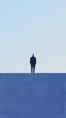 A lone person standing atop a solid blue horizontal surface