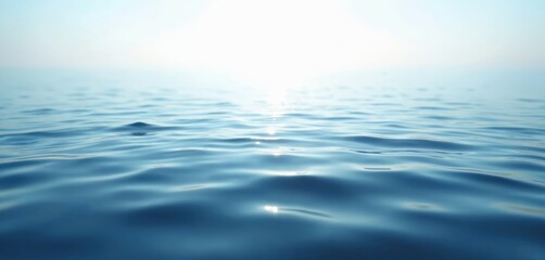 Calm blue sea water surface with soft waves. Marine abstract background shows tranquil ocean texture, depth, sunlight sparkles. Smooth liquid backdrop perfect for summer vacation, travel, nature