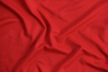 Texture of red jersey clothing fabric. Flatlay style, close up, studio shot. Sport background. Fabric commonly used for sportswear as football, basketball, volleyball, hockey, rugby etc