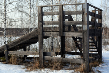 An old wooden slide in the countryside. Winter Fun Concept