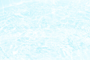 Blue water with ripples on the surface. Defocus blurred transparent blue colored clear calm water surface texture with splashes and bubbles. Water waves with shining pattern texture background.