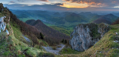 Green Spring Slovakia mountain nature landscape with sun and cross. Strazov hill in northwestern Slovakia at spring, Europe. Get to know the sports experience of hiking in the mountains.