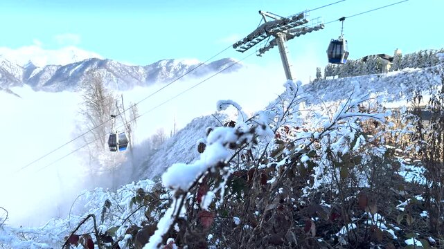 Cable cars ascend Gabala&rsquo;s snow-covered slopes with Mount Bazard&uuml;z&uuml; visible in the background in northern Azerbaijan