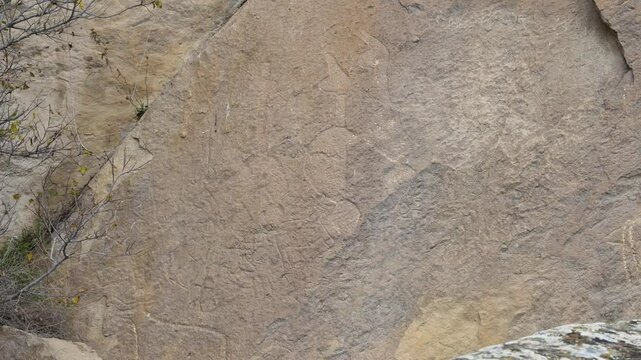 Close-up of ancient rock carvings on Gobustan&rsquo;s stone surface, showcasing prehistoric petroglyphs in Azerbaijan