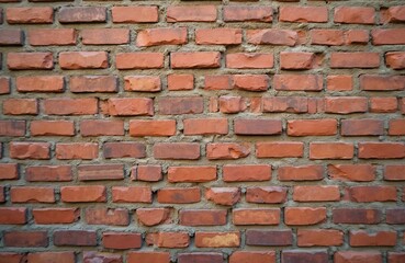 Obraz premium Rustic red brick wall background texture. Vintage stonewall wallpaper, loft interior design. Brown bricks masonry with cement. Old horizontal architecture surface, bumpy material.