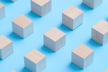 Minimalist Wooden Cubes on Blue