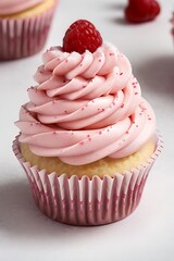Raspberry cream cupcake with pink frosting.