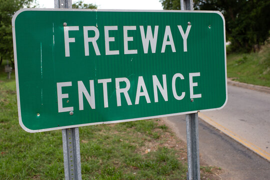 Freeway Entrance Sign at On-Ramp with Green Background

