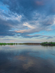 Calm lake with a cloudy sky in the background