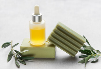 Olive oil serum and soap bars enhancing natural skincare routine
