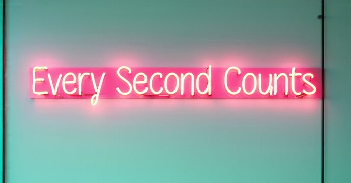 Neon sign every second counts deep crimson mint floating high performance leadership conference softly reflecting modern decor