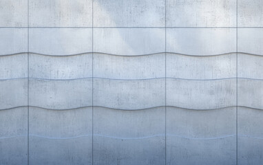 Smooth wave pattern on a concrete wall reflecting subtle light during the day