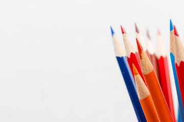 Wood-cased color pencils. Sharpened tips on white background.