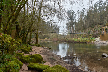 Scenic view of the Soutomaior bridge crossing the Verdugo river in lush green nature
